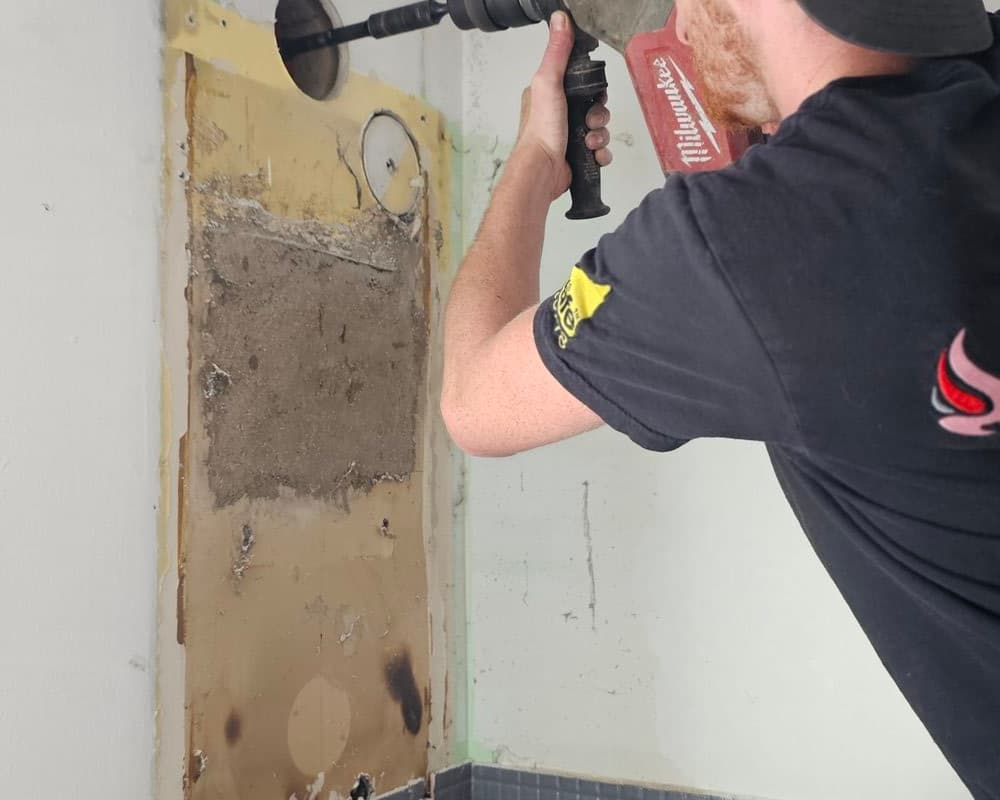 Henry from Flanders Plumbing installing a boiler in Sittingbourne